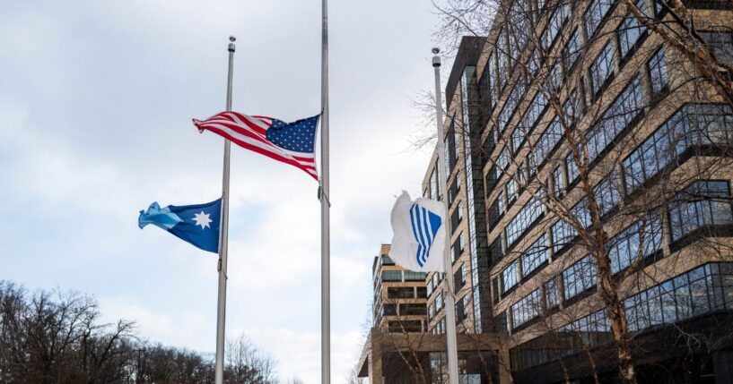 Flags fly at half mast outside the United Healthcare corporate headquarters on Dec. 4, 2024, in Minnetonka, Minnesota.