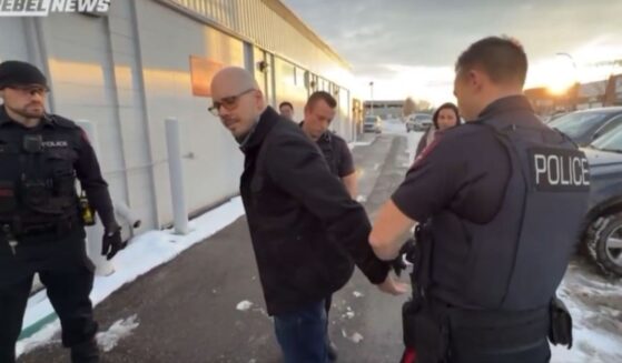 Canadian police arrest Pastor Derek Reimer for refusing to write a letter of apology to a librarian for disrupting a drag-queen story hour event.