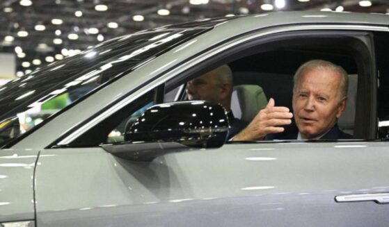 Then-President Joe Biden sits at the wheel of a Cadillac Lyriq electric vehicle as he visits the 2022 North American International Auto Show in Detroit, Michigan, on Sept. 14, 2022.