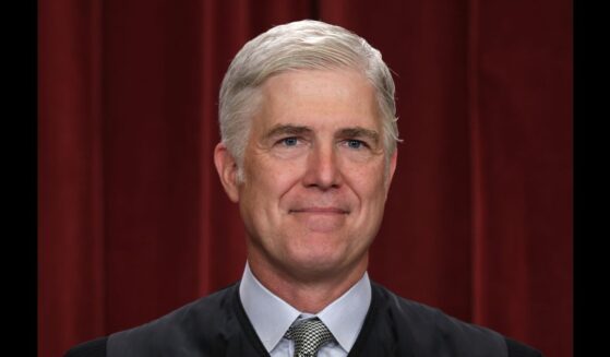 United States Supreme Court Associate Justice Neil Gorsuch poses for an official portrait in the Supreme Court building in Washington, DC on Oct. 7, 2022.