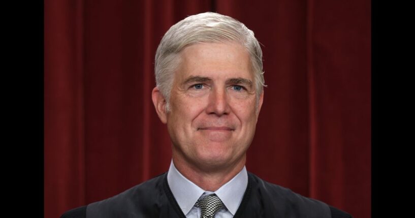 United States Supreme Court Associate Justice Neil Gorsuch poses for an official portrait in the Supreme Court building in Washington, DC on Oct. 7, 2022.