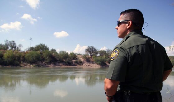 A Border Patrol agent looks out at the Rio Grande River in McAllen, Texas, on Sept. 21, 2016.