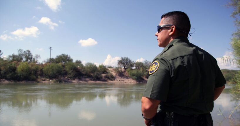 A Border Patrol agent looks out at the Rio Grande River in McAllen, Texas, on Sept. 21, 2016.