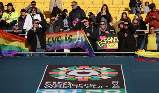 International soccer fans hold pride flags at the FIFA Women's World Cup Australia and New Zealand 2023 Quarter Final match on Aug. 11, 2023 in Wellington, New Zealand.