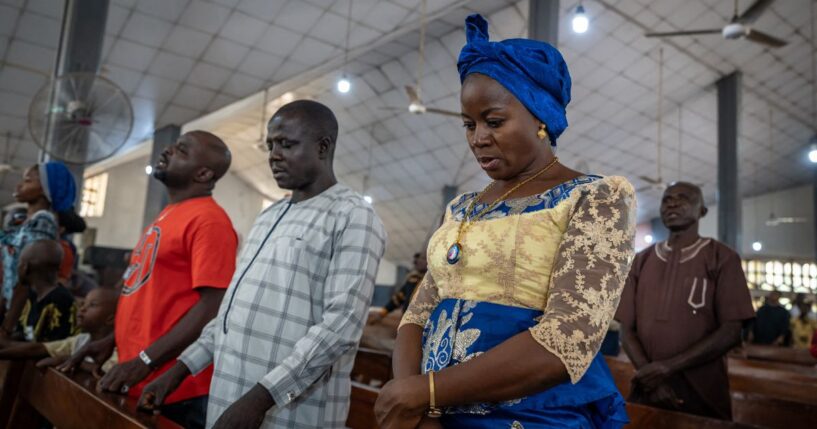 Catholics pray inside Saint Michael's Cathedral during a Sunday service in Minna on Nov. 30, 2025.