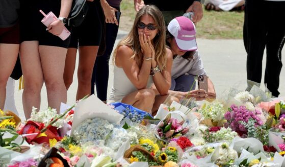 Mourners gather at a tribute to the victims of the Bondi Beach shooting that took place earlier in Sydney, Australia on Dec. 15, 2025.