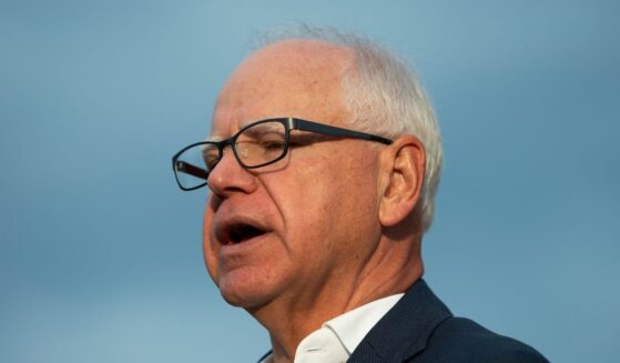 Minnesota Gov. Tim Walz speaks to reporters at Deerwood Elementary in Eagan, Minnesota, on Sept. 2, 2025.