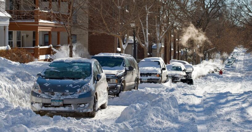 Snow covers a street in Minneapolis, Minnesota after a blizzard on Dec. 12, 2010.