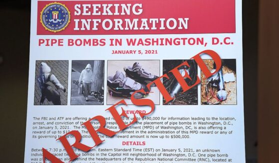 An FBI poster is displayed at the Department of Justice on Dec. 4 in Washington, D.C., during a press conference about the Jan. 6, 2021, pipe bomber case. Federal agents have charged Brian Cole with placing two pipe bombs, which never exploded, the night before the Jan. 6, 2021. U.S. Capitol incursion.