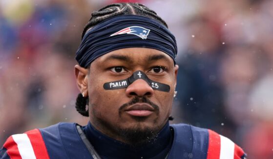 Stefon Diggs #8 of the New England Patriots stands on the sideline during the national anthem Dec. 14 before the game against the Buffalo Bills at Gillette Stadium in Foxborough, Massachusetts.
