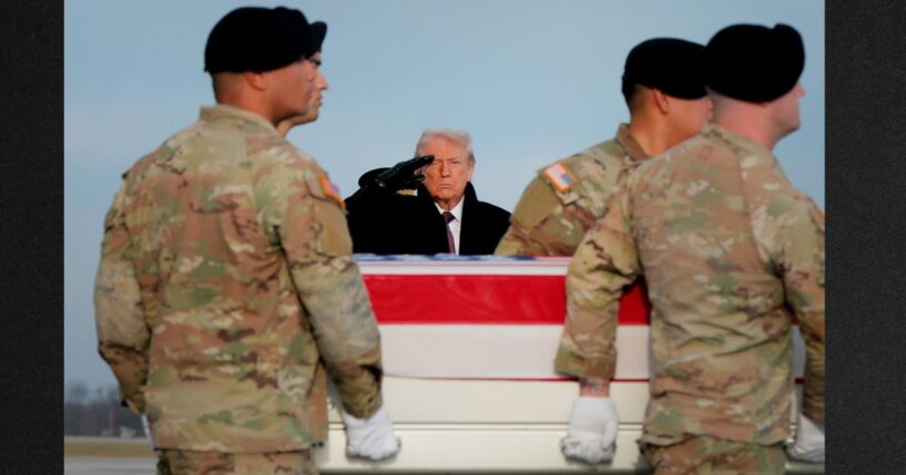 President Donald Trump salutes Wednesday as a U.S. Army carry team moves a flagged-draped transfer case containing the remains of Ayad Mansoor Sakat, a U.S. civilian working as an interpreter, at Dover Air Force Base in Dover, Delaware. Iowa National Guard members Sgt. William Nathaniel Howard and Sgt. Edgar Brian Torres-Tovar were also killed during a recent ambush by an Islamic State gunman in Syria. (Anna Moneymaker / Getty Images)