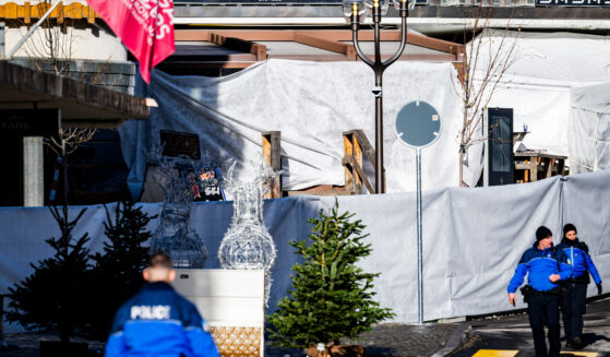 Police officers inspect the area where a fire broke out at the Le Constellation bar and lounge leaving people dead and injured, during New Year’s celebration, in Crans-Montana, Swiss Alps, Switzerland, on Jan. 1, 2026.