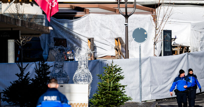 Police officers inspect the area where a fire broke out at the Le Constellation bar and lounge leaving people dead and injured, during New Year’s celebration, in Crans-Montana, Swiss Alps, Switzerland, on Jan. 1, 2026.