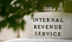 A sign is displayed outside the Internal Revenue Service building May 4, 2021, in Washington, D.C.
