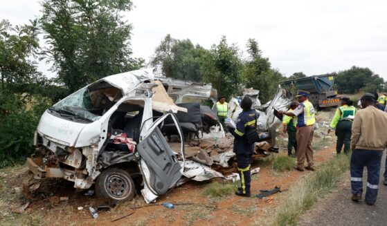 Police inspect the scene of a collision between a truck and a minibus carrying school children in Vanderbijlpark, South of Johannesburg, South Africa, on Jan. 19, 2026.