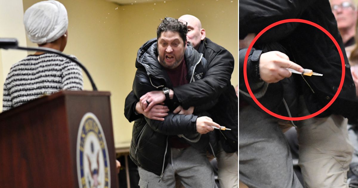 Anthony Kazmierczak is tackled after spraying a substance - later identified as vinegar - at Democratic Rep. Ilhan Omar of Minnesota, left, during a town hall she was hosting Wednesday in Minneapolis.