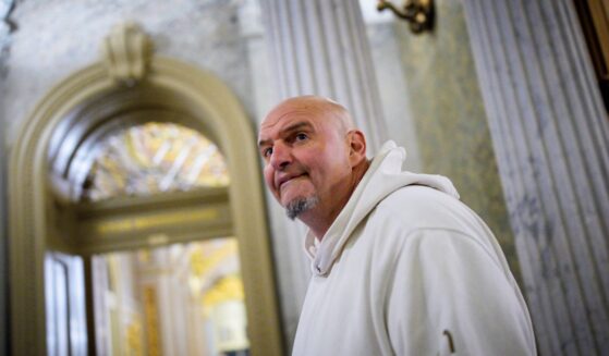 Sen. John Fetterman, one of eight Democrats to say he will vote with Republicans to open the government, arrives for votes on Nov. 10, 2025, on Capitol Hill in Washington, D.C.
