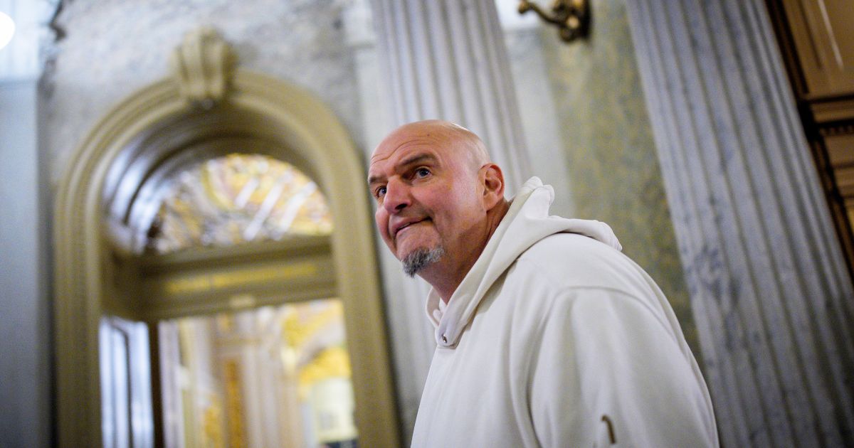 Sen. John Fetterman, one of eight Democrats to say he will vote with Republicans to open the government, arrives for votes on Nov. 10, 2025, on Capitol Hill in Washington, D.C.