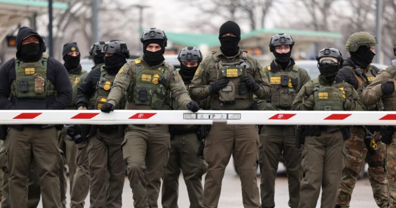 U.S. Border Patrol agents stand guard at the Bishop Henry Whipple Federal Building in Minneapolis, Minnesota, on Jan. 8, 2026.
