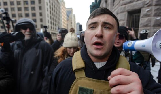 Right wing influencer Jake Lang is confronted by protesters at a rally near city hall on Jan. 17, 2026, in Minneapolis, Minnesota.