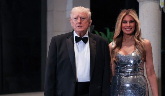 President Donald Trump and First Lady Melania Trump arrive for a New Year’s Eve event at his Mar-a-Lago home on Dec. 31, 2025, in Palm Beach, Florida.
