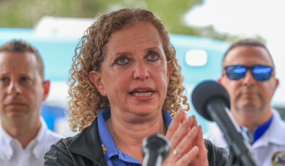 Rep. Debbie Wasserman Schultz, Rep. Jared Moskowitz, and Rep. Darren Soto during a press conference after visiting "Alligator Alcatraz" at the Dade-Collier Training and Transition Airport on July 12, 2025, in Ochopee, Florida.