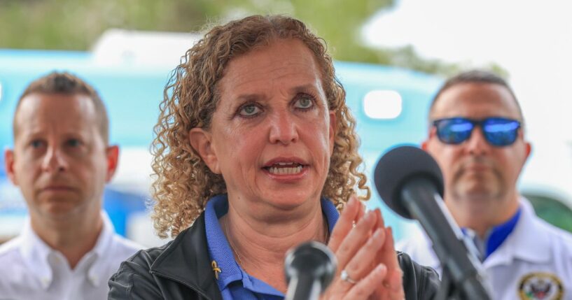 Rep. Debbie Wasserman Schultz, Rep. Jared Moskowitz, and Rep. Darren Soto during a press conference after visiting "Alligator Alcatraz" at the Dade-Collier Training and Transition Airport on July 12, 2025, in Ochopee, Florida.