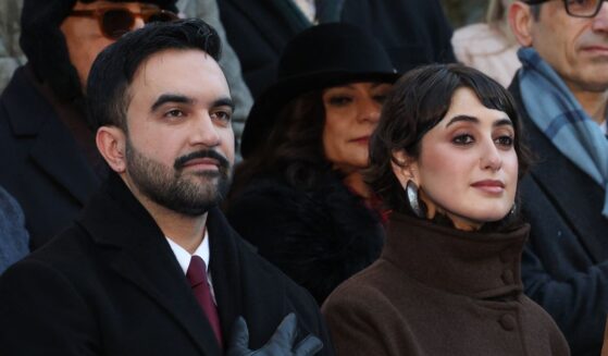 New York City Mayor Zohran Mamdani and his wife Rama Duwaji listen to the national anthem during his public inauguration ceremony followed by a block party at City Hall in New York on Jan. 1, 2026.