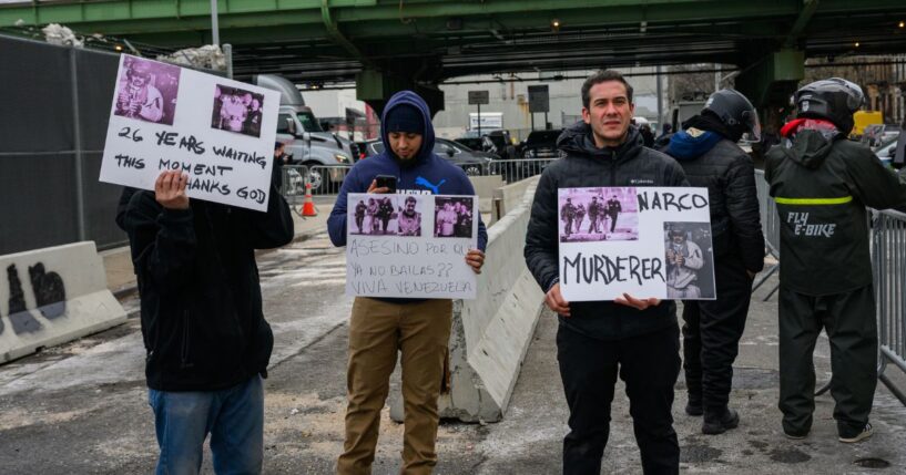 A few protestors hold signs in favor of Maduro's detention outside the MDC detention center on Jan. 5, 2026, in New York City.