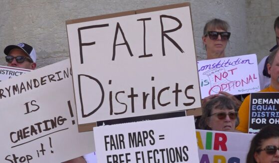 This photo taken from video shows organizers rallying outside of the Ohio Statehouse to protest gerrymandering and advocate for lawmakers to draw fair maps in Columbus, Ohio, on Sept. 17, 2025.