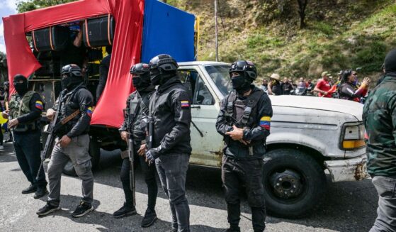 Members of a pro-government group known as the "Colectivos" stand guard during military exercises announced by President Nicolas Maduro in Caracas on Jan. 23, 2025.
