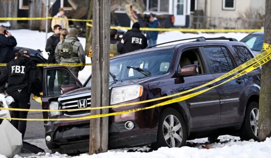 Members of law enforcement work the scene following a suspected shooting by an ICE agent during federal law enforcement operations on Jan. 7, 2026, in Minneapolis, Minnesota.