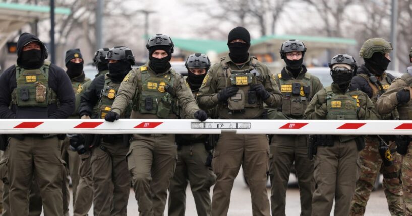 U.S. Border Patrol agents stand guard at the Bishop Henry Whipple Federal Building in Minneapolis, Minnesota, on Jan. 8, 2026.