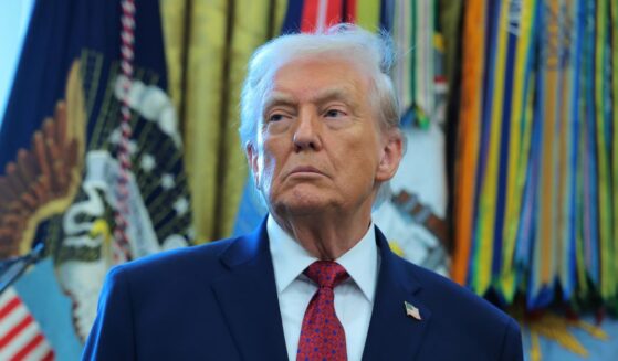 President Donald Trump listens during a ceremony for the presentation of the Mexican Border Defense Medal in the Oval Office of the White House on Dec. 15, 2025, in Washington, D.C.