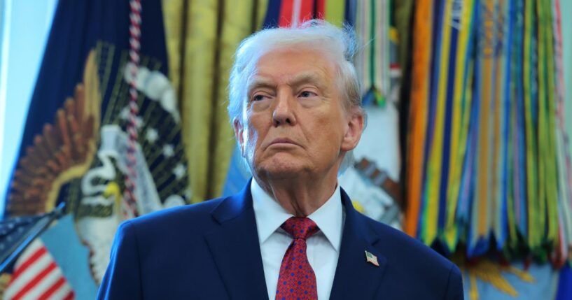 President Donald Trump listens during a ceremony for the presentation of the Mexican Border Defense Medal in the Oval Office of the White House on Dec. 15, 2025, in Washington, D.C.