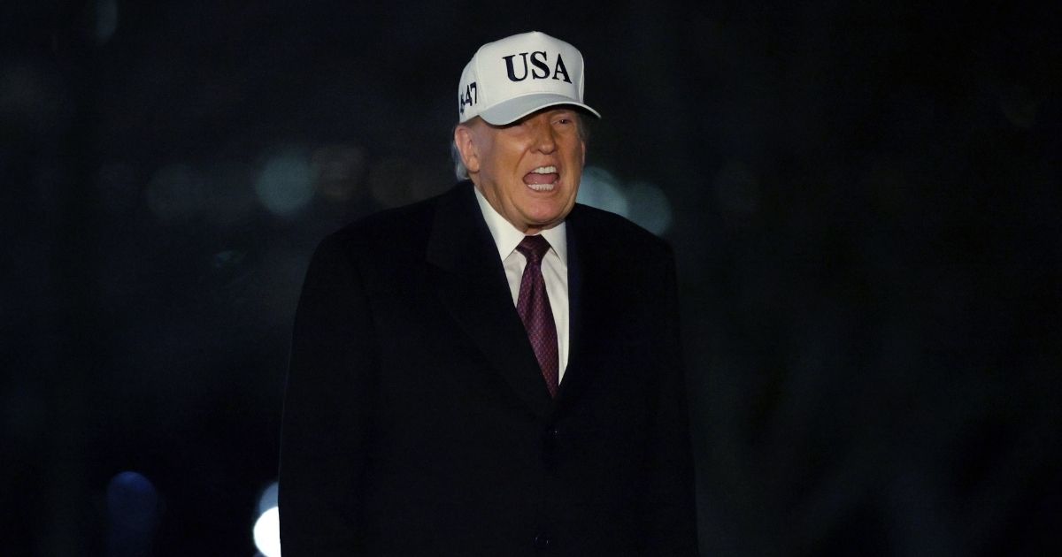 President Donald Trump walks on the South Lawn after he landed at the White House on Jan. 11, 2026, in Washington, D.C.