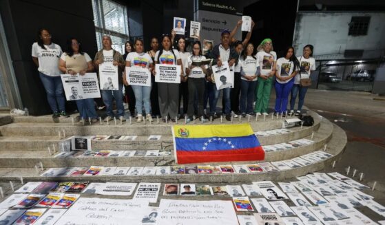 People attend a vigil to demand freedom for political prisoners at El Helicoide, a facility and prison owned by the Venezuelan government and used for both regular and political prisoners of the Bolivarian National Intelligence Service, in Caracas, Venezuela, on Jan. 13, 2026.