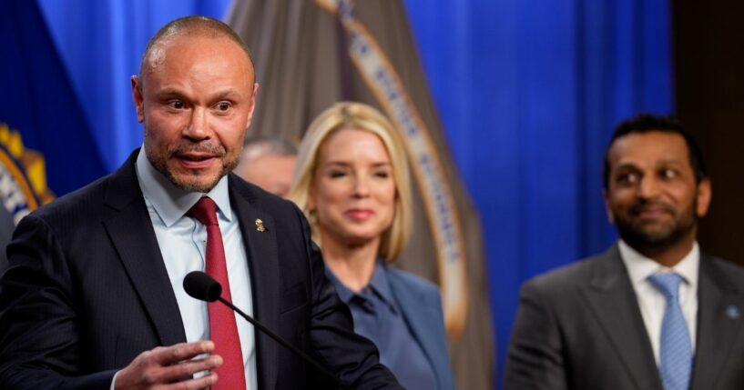 FBI Deputy Director Dan Bongino, accompanied by Attorney General Pam Bondi and FBI Director Kash Patel, speaks during a news conference on an arrest of a suspect in the Jan. 6 pipe bomber at the Department of Justice on Dec. 4, 2025, in Washington, D.C.