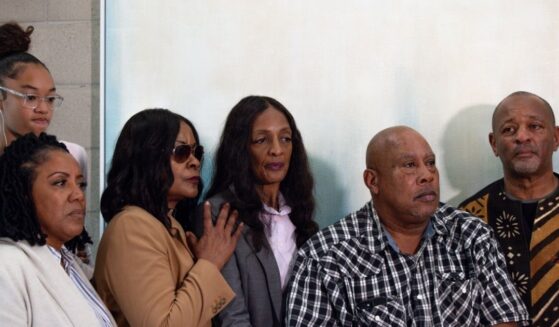 Family and friends of Keith Porter Jr. pose for a photo after a news conference on Jan. 5, 2026, in Studio City, California.