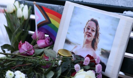 Flowers and candles are seen at a vigil for Renee Nicole Good in front of the United States embassy on Jan. 11, 2026, in Berlin, Germany.