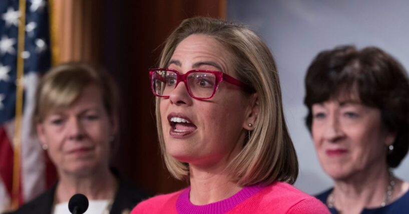 Now-former Sen. Kyrsten Sinema speaks to reporters following Senate passage of the Respect for Marriage Act at the U.S. Capitol in Washington, D.C., on Nov. 29, 2022.