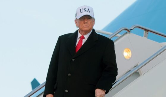 President Donald Trump walks down the air stairs after landing on Air Force One on Jan. 13, 2026, at Joint Base Andrews, Maryland.