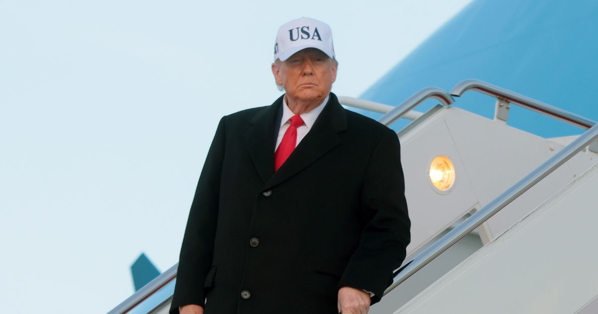 President Donald Trump walks down the air stairs after landing on Air Force One on Jan. 13, 2026, at Joint Base Andrews, Maryland.