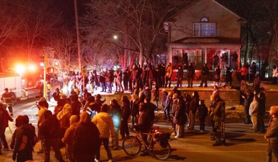 Residents confront federal agents following a shooting incident on Jan. 14, 2026, in Minneapolis, Minnesota.