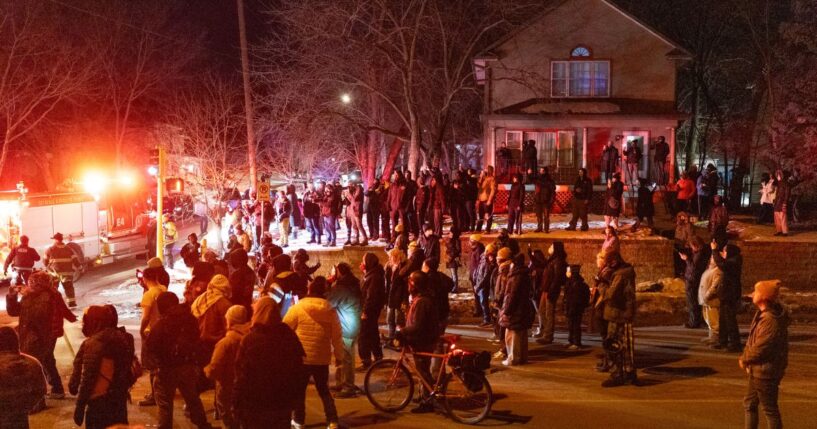 Residents confront federal agents following a shooting incident on Jan. 14, 2026, in Minneapolis, Minnesota.