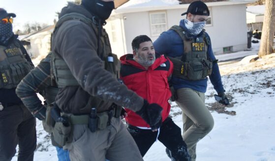 Federal immigration agents detain a man during an operation by Immigration and Customs Enforcement and Border Patrol in St. Paul, Minnesota, on Jan. 27, 2026.
