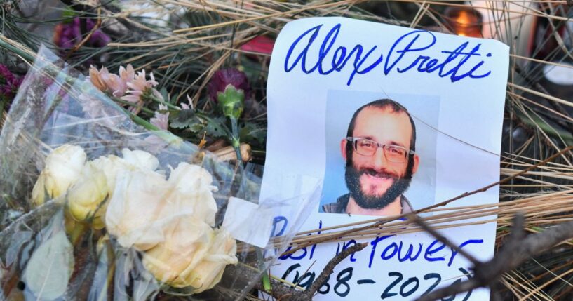 Flowers are left at a makeshift memorial in the area where Alex Pretti was shot dead a day earlier by federal immigration agents in Minneapolis, Minnesota, on Jan. 25, 2026.