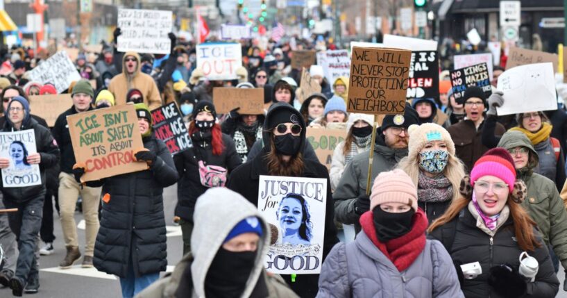 Protesters hold signs as they march from Powderhorn Park in Minneapolis against Immigration and Customs Enforcement and the fatal shooting of Renee Good by an ICE agent, calling on federal authorities to leave the city, in Minneapolis, Minnesota, on Jan. 10, 2026.