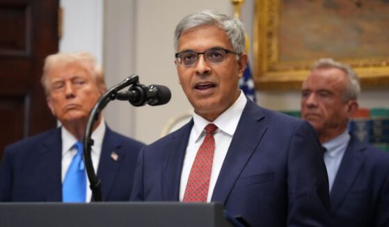 Director of the National Institutes of Health Jay Bhattacharya, joined by President Donald Trump and Health and Human Services Secretary Robert F. Kennedy Jr., delivers remarks during an announcement by President Donald Trump on “significant medical and scientific findings for America’s children” in the Roosevelt Room of the White House on Sept. 22, 2025, in Washington, D.C.