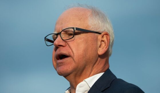 Minnesota Gov. Tim Walz speaks to media gathered on the first day of school at Deerwood Elementary on Sept. 2, 2025, in Eagan, Minnesota.